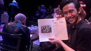 Laurence Guillermo poses with his copy of “Hound Dog: The Leiber and Stoller Autobiography”