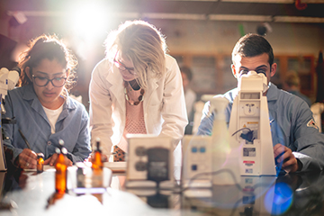 SMC Stem students working with professor