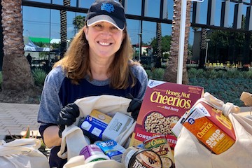 Lizzy Moore displays groceries and food items