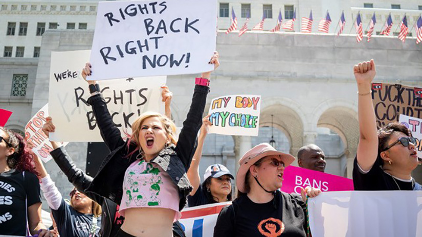 Caylo Seals won a first place JACC award for this news photo of Shira Yevin (left), founder of Gritty in Pink during a protest organized by Women's March Foundation LA, Rise Up 4 Abortion Rights LA, and several other groups outside Los Angeles City Hall in downtown Los Angeles, Calif., on Saturday, April 15, 2023. (Caylo Seals | The Corsair)