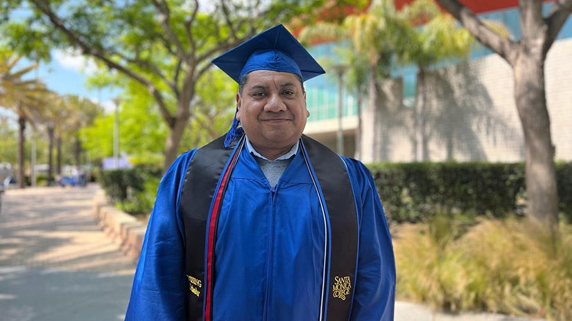 Jose Rosales standing in the SMC Quad before graduation.