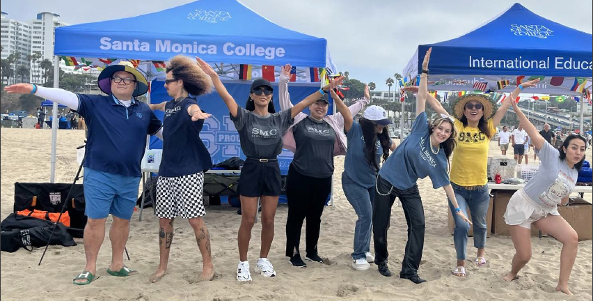 Group of students posing at the beach